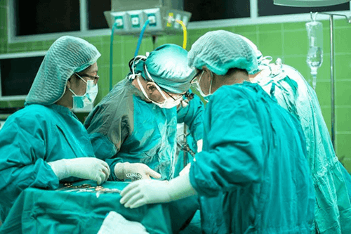 Surgeons operating.