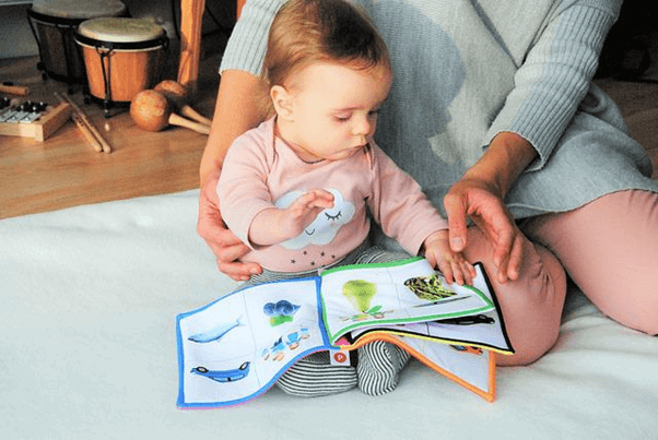 Baby reading a book