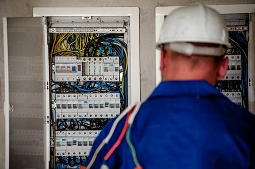 worker analysing electrical equipment