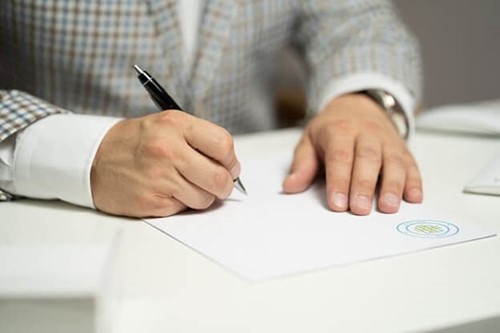 an employee signing a contract
