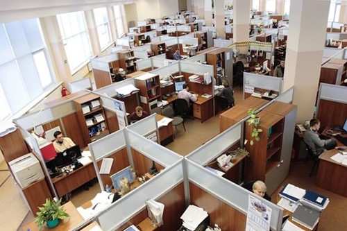 a large office full of cubicle desks
